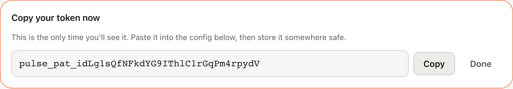 The reveal-once card showing a freshly minted pulse_pat_ token with a Copy button — Pulse stores only its hash, so it can't be shown again.